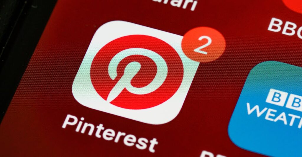 Close-up of Pinterest app icon and notifications on a smartphone screen, detailed and vibrant technologically themed image.